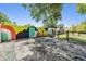 Spacious backyard with a picnic table and a fence with colorful artwork at 1708 Julian Lane Dr, Tampa, FL 33619