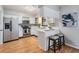 Bright kitchen featuring stainless steel appliances, white cabinetry, and breakfast bar with seating at 1708 Julian Lane Dr, Tampa, FL 33619