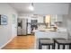 Bright kitchen featuring stainless steel appliances, white cabinetry, and breakfast bar with seating at 1708 Julian Lane Dr, Tampa, FL 33619