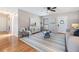 Open-concept living room with hardwood floors, a stylish rug, and neutral decor at 1708 Julian Lane Dr, Tampa, FL 33619