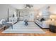 Comfortable living room with a ceiling fan, hardwood floors, and plenty of natural light at 1708 Julian Lane Dr, Tampa, FL 33619