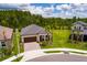 Stunning aerial view of a single Gathering home with a tile roof, and green lawn in a desirable neighborhood at 17263 Mango Shay Ct, Land O Lakes, FL 34638
