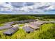 Aerial view of the home located in a lush community surrounded by greenery at 17263 Mango Shay Ct, Land O Lakes, FL 34638