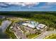 Community aerial view showcases a new neighborhood with amazing amenities including a pool, clubhouse, and sports courts at 17263 Mango Shay Ct, Land O Lakes, FL 34638