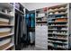 Spacious closet featuring shelving, hanging racks, drawers and ample storage for clothes and accessories at 17263 Mango Shay Ct, Land O Lakes, FL 34638