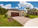 Charming home with a well maintained brick driveway and a beautifully landscaped yard, showcasing curb appeal at 17263 Mango Shay Ct, Land O Lakes, FL 34638