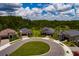 Exterior view of a home in a cul-de-sac with a well-manicured lawn and a two car garage at 17263 Mango Shay Ct, Land O Lakes, FL 34638