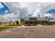 Charming community farm building with farmhouse-style architecture, a covered porch, and well-maintained landscaping at 17263 Mango Shay Ct, Land O Lakes, FL 34638