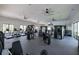 Well-equipped gym with treadmills, weight machines, and ceiling fans in a spacious workout area for residents at 17263 Mango Shay Ct, Land O Lakes, FL 34638