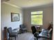 Bright office space with a neutral color palette and natural light from the window at 17263 Mango Shay Ct, Land O Lakes, FL 34638