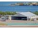 Aerial view of Albert Whitted Airport featuring various airplanes, a hanger, and waterfront views at 199 Dali Blvd # 2, St Petersburg, FL 33701