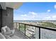 Comfortable balcony with cushioned chairs offers stunning views of the bay and Albert Whitted Airport at 199 Dali Blvd # 2, St Petersburg, FL 33701
