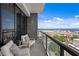 Enjoy breathtaking water views from this condo balcony with comfortable seating at 199 Dali Blvd # 2, St Petersburg, FL 33701