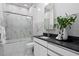 Contemporary bathroom with marble accents, glass shower, and modern vanity at 199 Dali Blvd # 2, St Petersburg, FL 33701