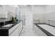 Spacious modern bathroom with marble floors, dual vanity and soaking tub at 199 Dali Blvd # 2, St Petersburg, FL 33701
