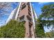 Stylish high-rise building showcasing modern architecture and inviting balconies, enhanced by lush greenery at 199 Dali Blvd # 2, St Petersburg, FL 33701