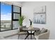 Cozy dining nook featuring modern table and chairs, stylish decor and a large window with city views at 199 Dali Blvd # 2, St Petersburg, FL 33701
