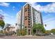 Modern apartment building boasting a combination of white and brown finishes with private balconies and manicured landscaping at 199 Dali Blvd # 2, St Petersburg, FL 33701