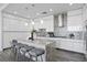Sleek kitchen featuring white cabinetry, stainless steel appliances, gray countertops, and a stylish island at 199 Dali Blvd # 2, St Petersburg, FL 33701