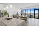 Open kitchen design with granite island, pendant lighting, stainless appliances and adjacent dining area at 199 Dali Blvd # 2, St Petersburg, FL 33701