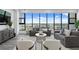 Well-lit living room with elegant furnishings and amazing panoramic views of the city and marina at 199 Dali Blvd # 2, St Petersburg, FL 33701