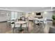 Spacious lounge area featuring multiple seating arrangements and tables, perfect for gatherings and relaxation at 199 Dali Blvd # 2, St Petersburg, FL 33701