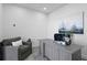 Well-lit home office with a comfortable armchair, desk, and a calming painting enhancing the workspace at 199 Dali Blvd # 2, St Petersburg, FL 33701