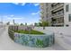 Artistic outdoor space with a unique metal sculpture and a colorful mural at 199 Dali Blvd # 2, St Petersburg, FL 33701