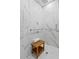 Elegant marble shower with wood bench seating, grab bars and tiled floor at 199 Dali Blvd # 2, St Petersburg, FL 33701