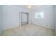 Bedroom featuring a ceiling fan, natural light, neutral walls, and a closet at 209 S Greenfield Ave, Temple Terrace, FL 33617