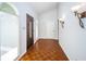 Bright entryway with wood floors, stylish lighting, and a modern, inviting feel at 209 S Greenfield Ave, Temple Terrace, FL 33617
