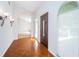 Bright and airy entryway featuring wood floors, modern lighting, and an inviting design at 209 S Greenfield Ave, Temple Terrace, FL 33617