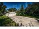 Charming one-car garage with ample parking space and well-maintained lawn at 209 S Greenfield Ave, Temple Terrace, FL 33617