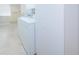 Laundry area with washer, dryer, storage cabinet, and window at 209 S Greenfield Ave, Temple Terrace, FL 33617