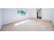 Bright living room with a large window, providing ample natural light at 209 S Greenfield Ave, Temple Terrace, FL 33617