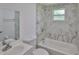 Beautiful bathroom featuring modern fixtures and marble look shower tile at 2112 33Rd Se St, Ruskin, FL 33570