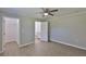 Spacious bedroom with vinyl flooring, neutral paint, ceiling fan, and closet at 2112 33Rd Se St, Ruskin, FL 33570