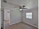 This is a bedroom featuring a ceiling fan and a window that lets in plenty of natural light at 2112 33Rd Se St, Ruskin, FL 33570