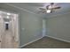 Bright bedroom features wood-look floors, ceiling fan, and ample closet space at 2112 33Rd Se St, Ruskin, FL 33570