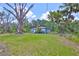 Charming single-story home with lush green lawn and mature trees offering shade and curb appeal at 2112 33Rd Se St, Ruskin, FL 33570