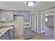 Updated kitchen with gray cabinets, granite counters, new appliances and entry door at 2112 33Rd Se St, Ruskin, FL 33570