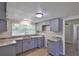 Updated kitchen with gray cabinets, granite counters, new appliances and a window at 2112 33Rd Se St, Ruskin, FL 33570