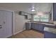 Bright kitchen features modern gray cabinets, granite countertops, and wood-look flooring at 2112 33Rd Se St, Ruskin, FL 33570