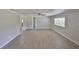 Open living space with modern flooring, neutral walls and ceiling fan creating a blank canvas at 2112 33Rd Se St, Ruskin, FL 33570