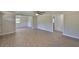 Bright and airy living room with ceiling fan and neutral walls, providing a versatile space at 2112 33Rd Se St, Ruskin, FL 33570