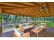 Covered patio features an outdoor seating area with comfortable furniture and a scenic view at 2112 33Rd Se St, Ruskin, FL 33570