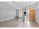 Bright living room featuring wood-look tile flooring and natural light at 2498 Saddlewood Ln, Palm Harbor, FL 34685