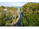 Waterfront property with lush landscaping, path, and lake views at 2533 Dolly Bay Dr # 203, Palm Harbor, FL 34684