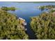Aerial view showcases multiple boats docked at this lakefront community at 2533 Dolly Bay Dr # 203, Palm Harbor, FL 34684