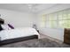 Inviting bedroom with natural light, featuring a comfortable bed and calming neutral tones at 2533 Dolly Bay Dr # 203, Palm Harbor, FL 34684